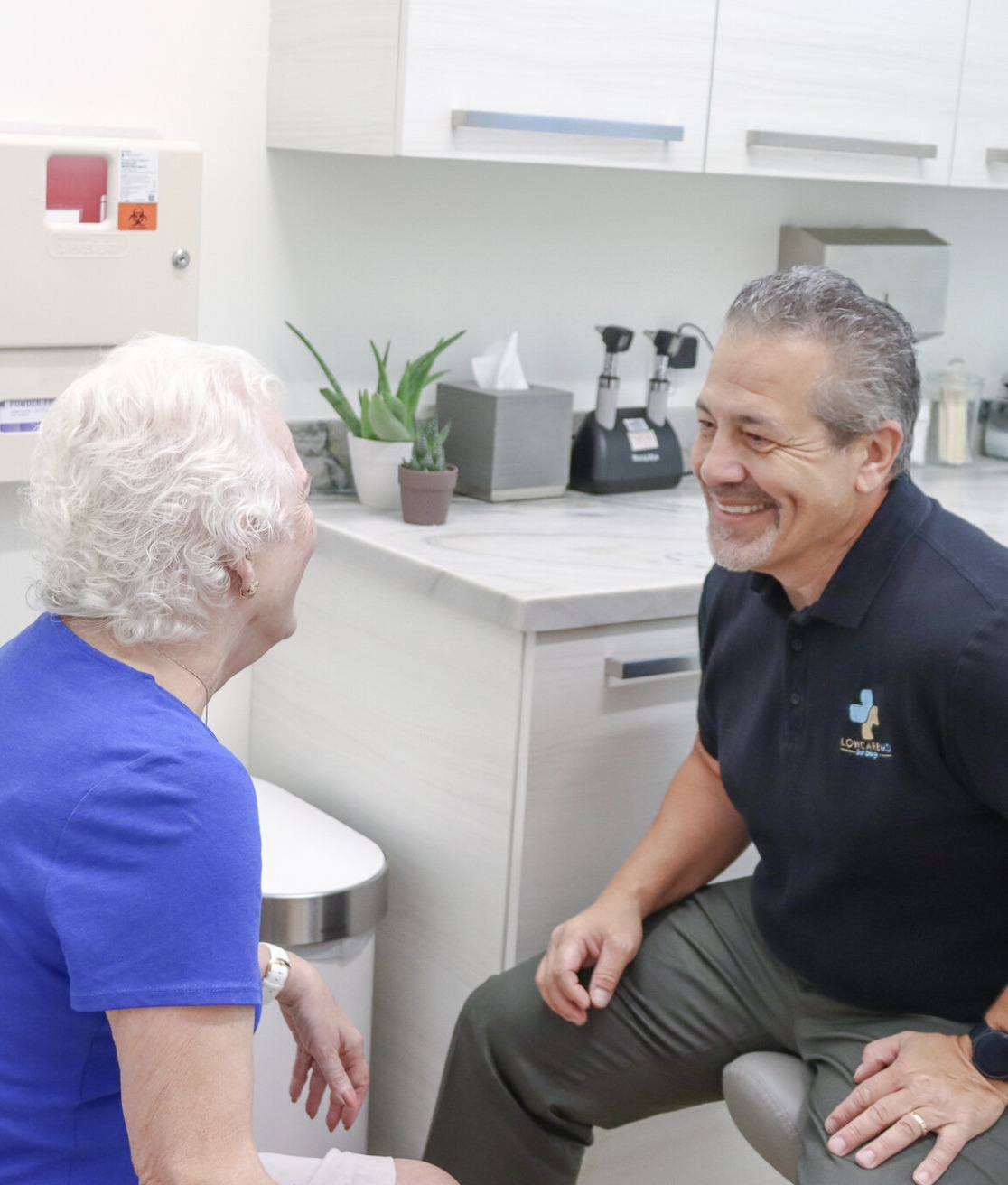 DR. BRIAN LENZKES WITH PATIENT